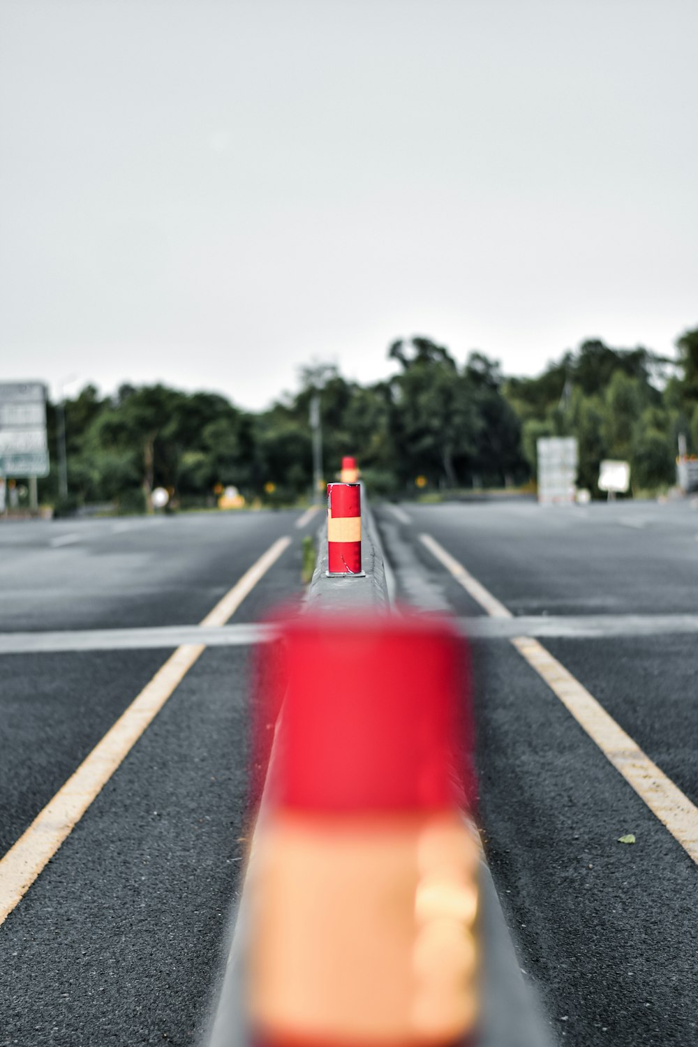 red traffic light on gray asphalt road during daytime