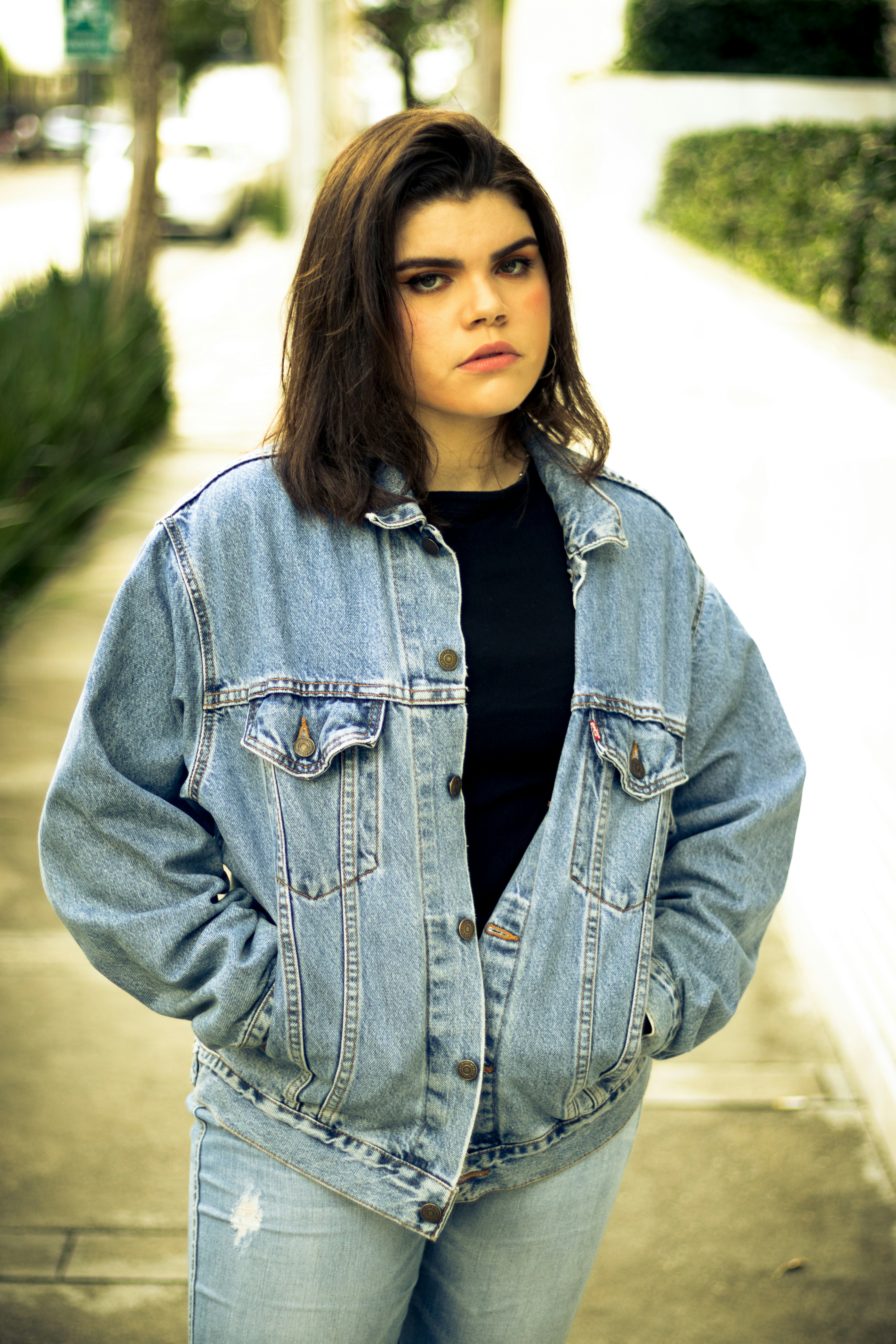 Woman in blue denim jacket standing on road during daytime photo – Free ...
