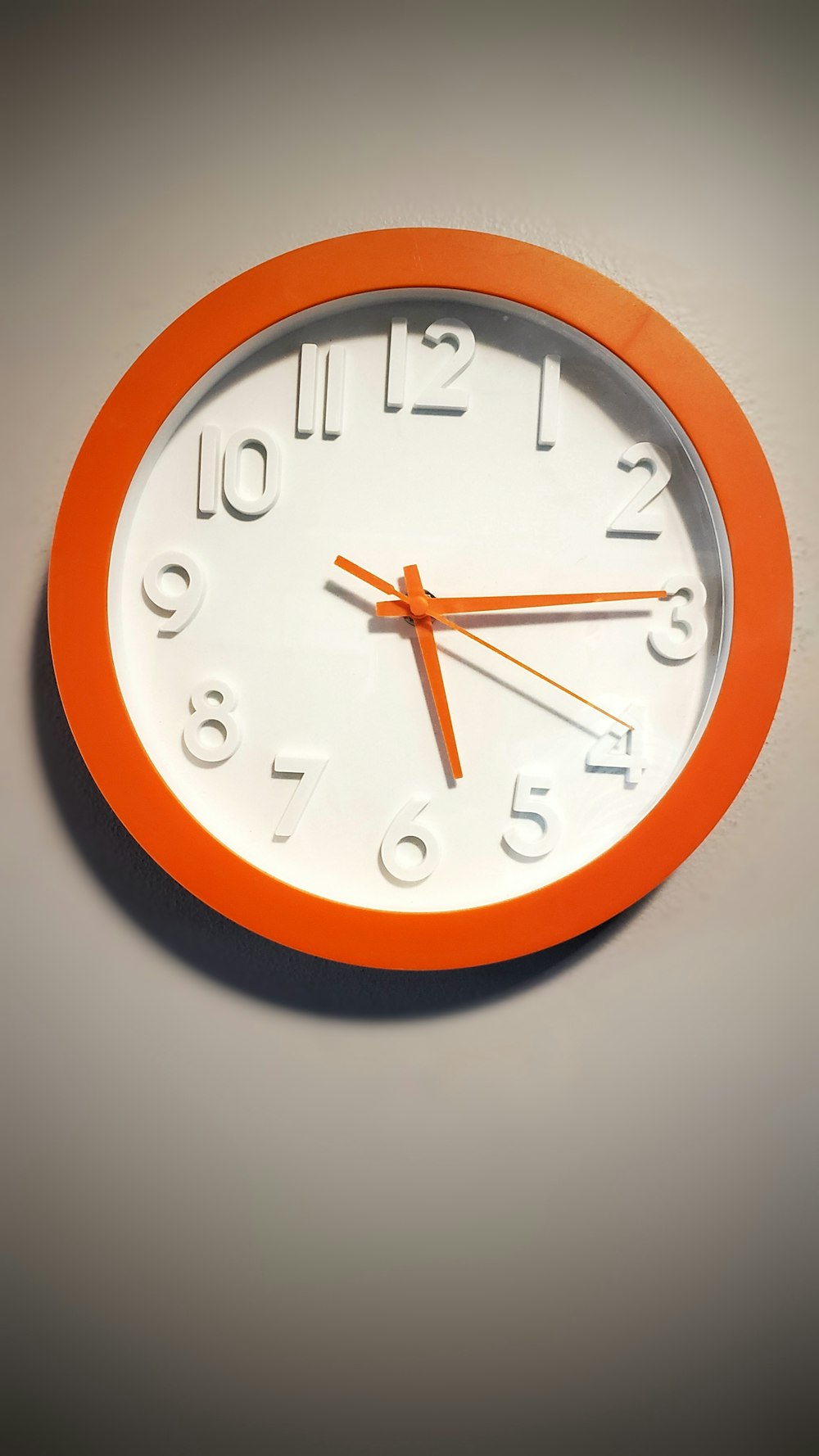 brown and white analog wall clock