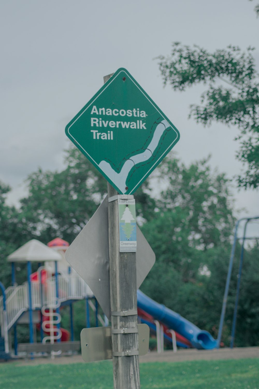 a sign that is on top of a wooden pole