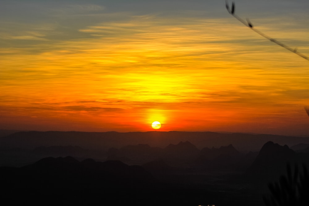 silhouette of mountain during sunset