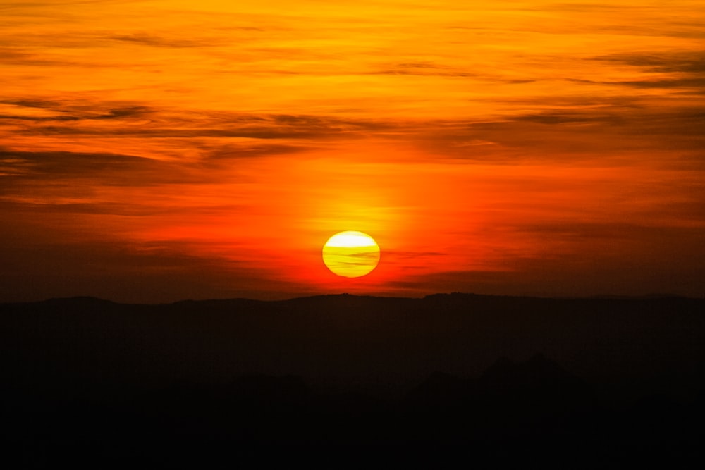 silhouette of mountain during sunset