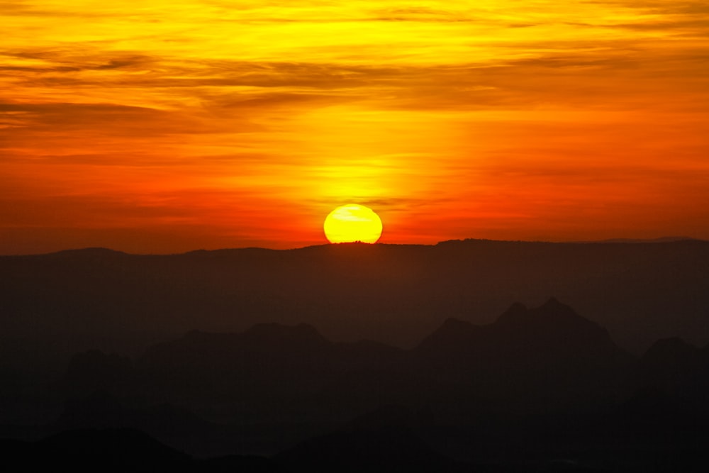 silhouette of mountains during sunset