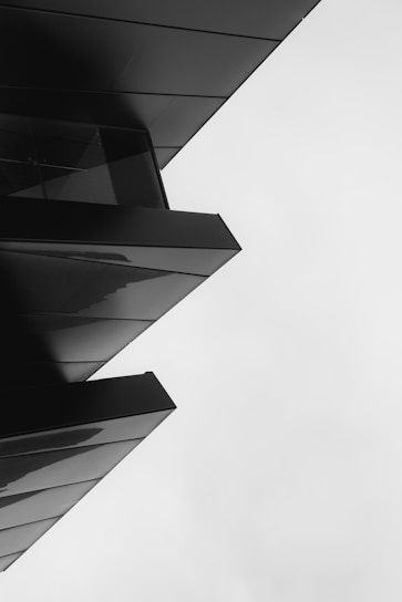 A sleek, modern 3D website design in black and white.