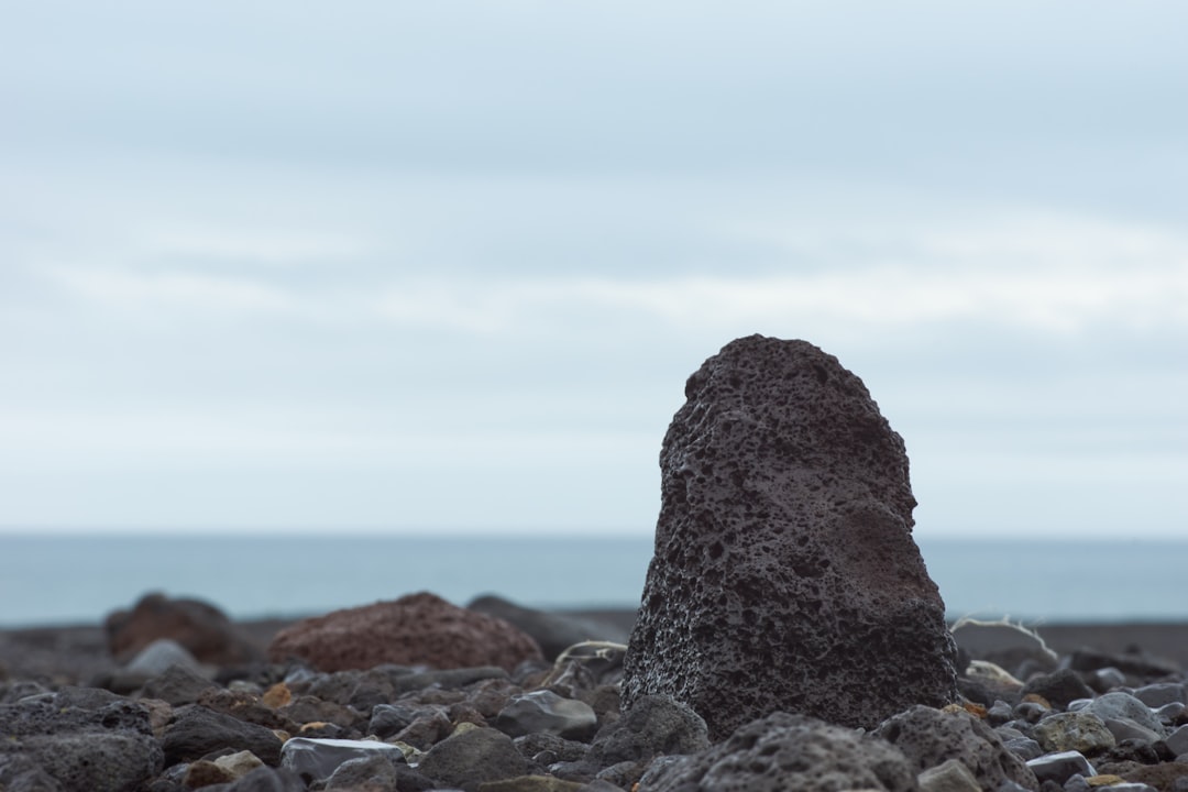 gray rock formation on the beach during daytime