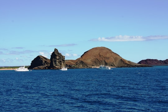 brown rock formation on sea during daytime in Bartolomé Island Ecuador