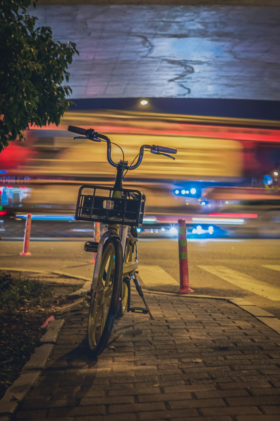 black bicycle on road during night time