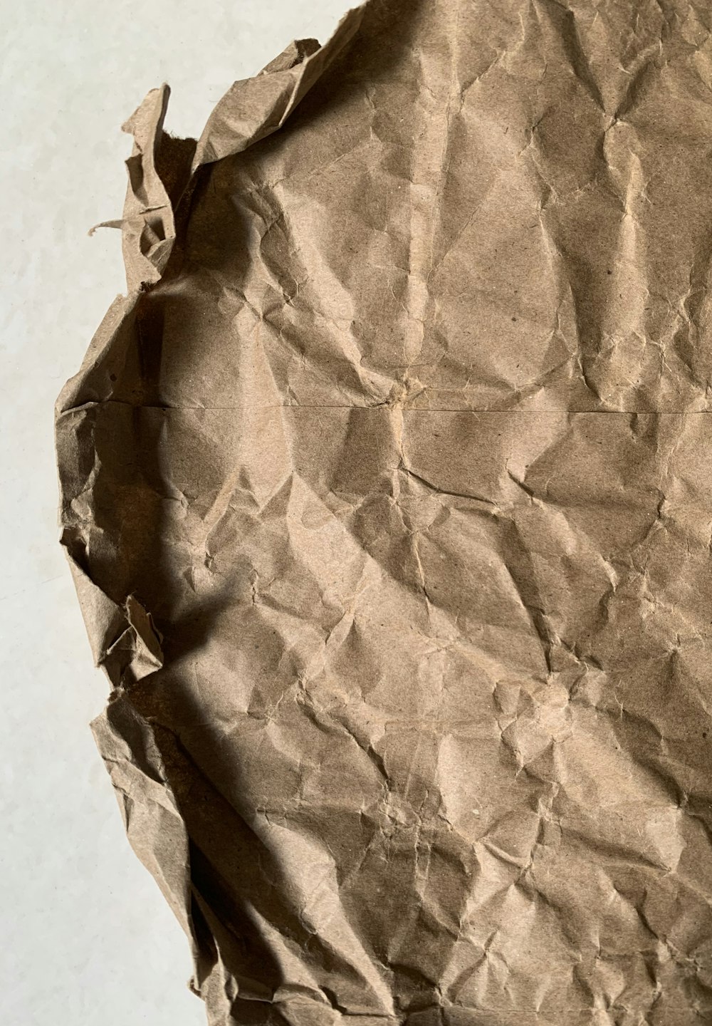 brown paper bag on white table