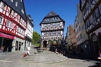 A charming medieval town square filled with colorful buildings and cobblestone streets.