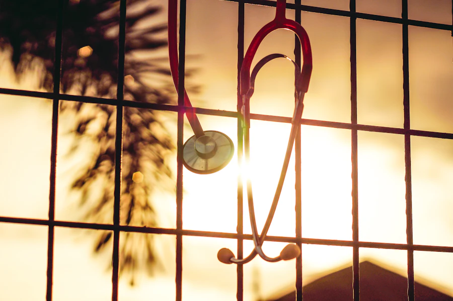 Stethoscope silhouetted against a sunrise