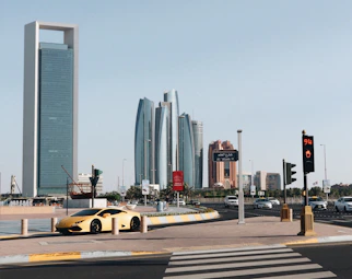 yellow car on road near building during daytime
