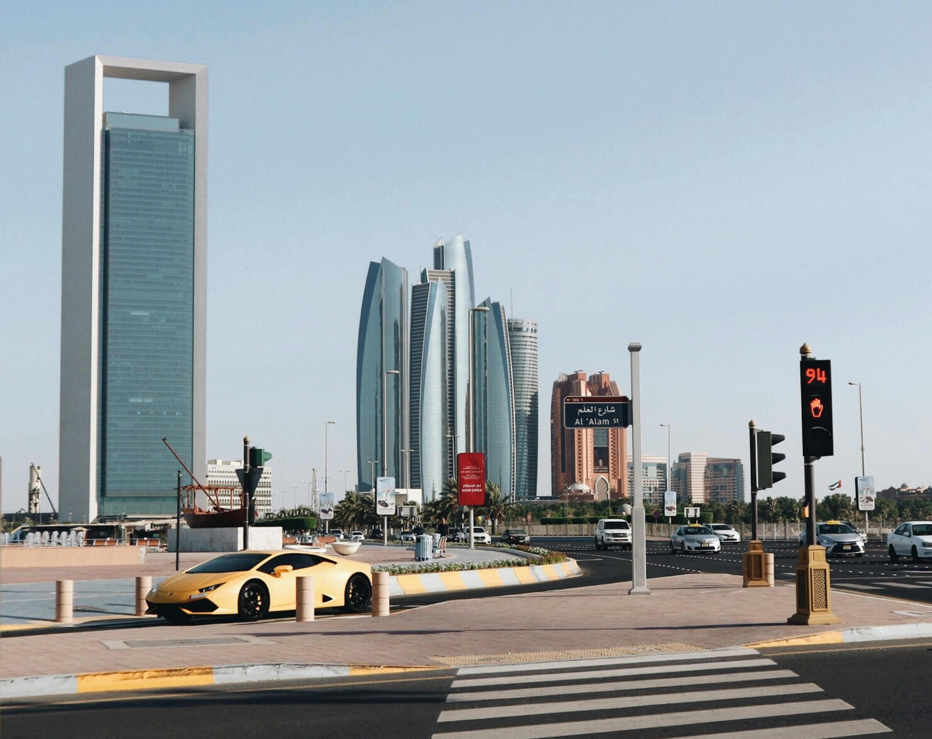 yellow car on road near building during daytime