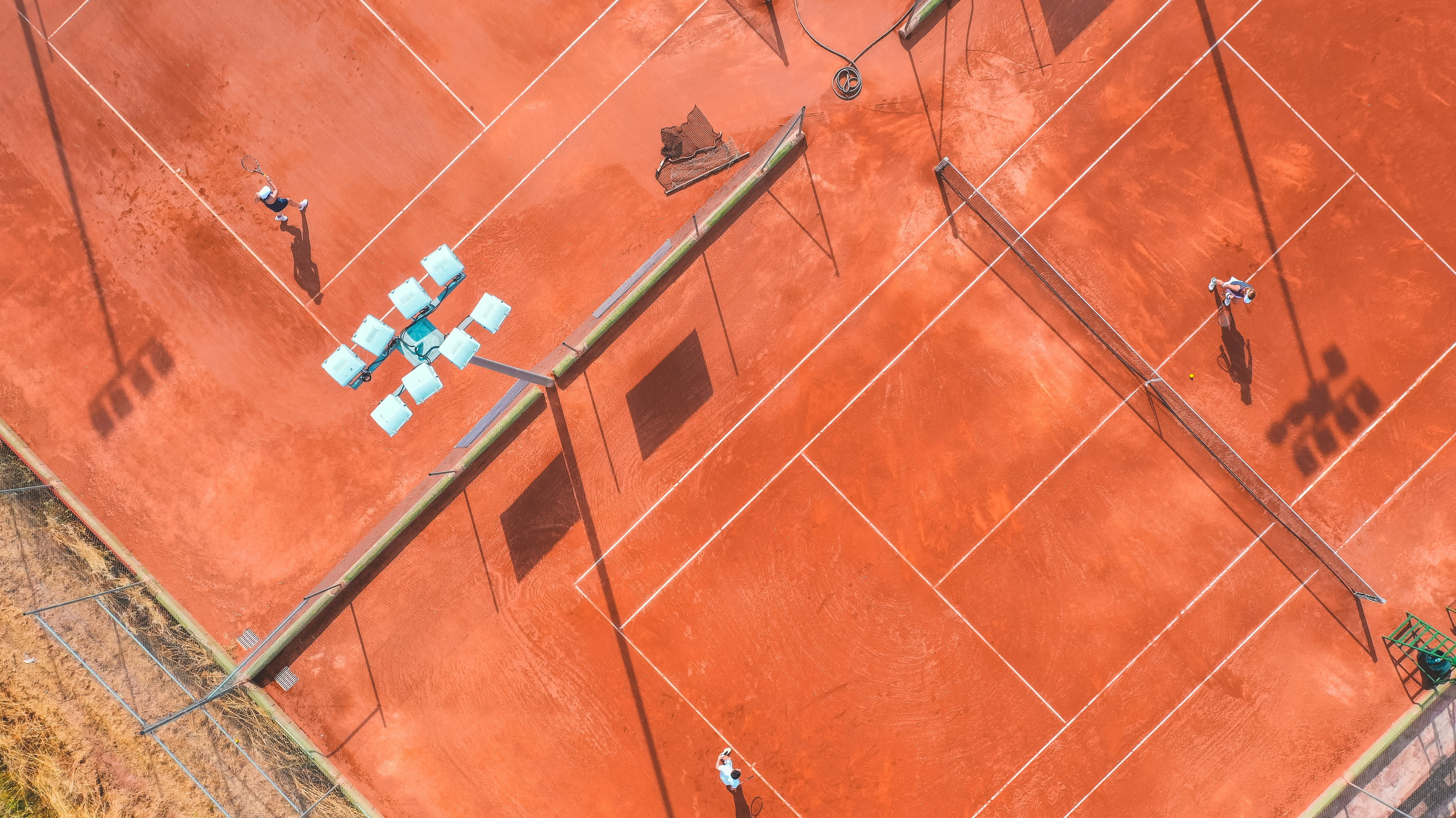 white and blue lego blocks on brown floor tiles
