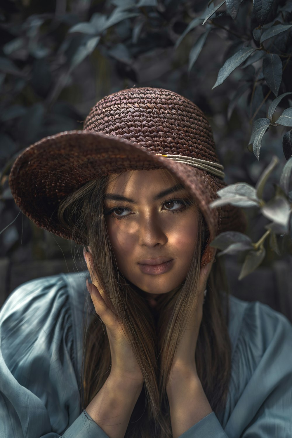 woman in brown and black hat