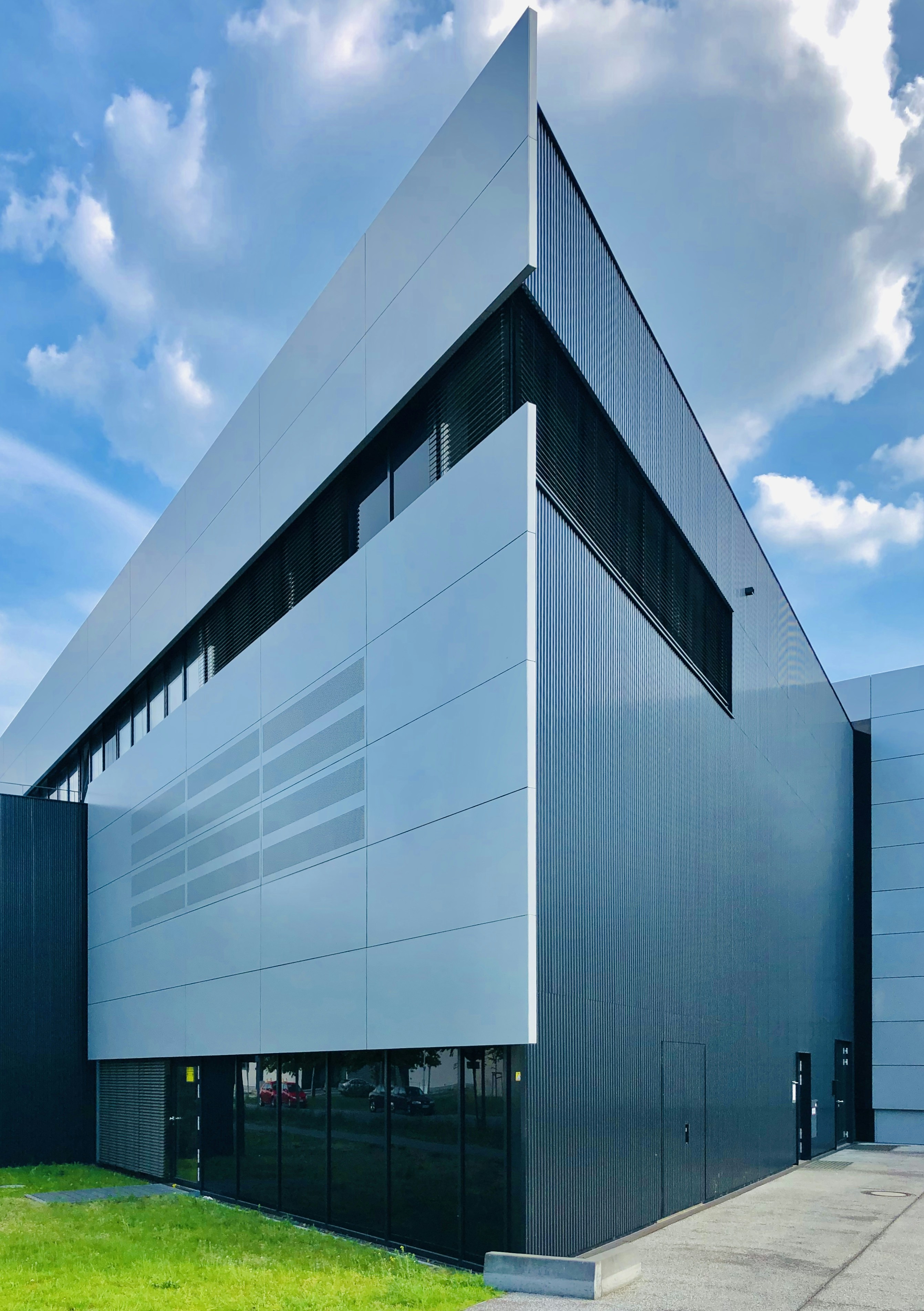 blue and white concrete building under blue sky during daytime