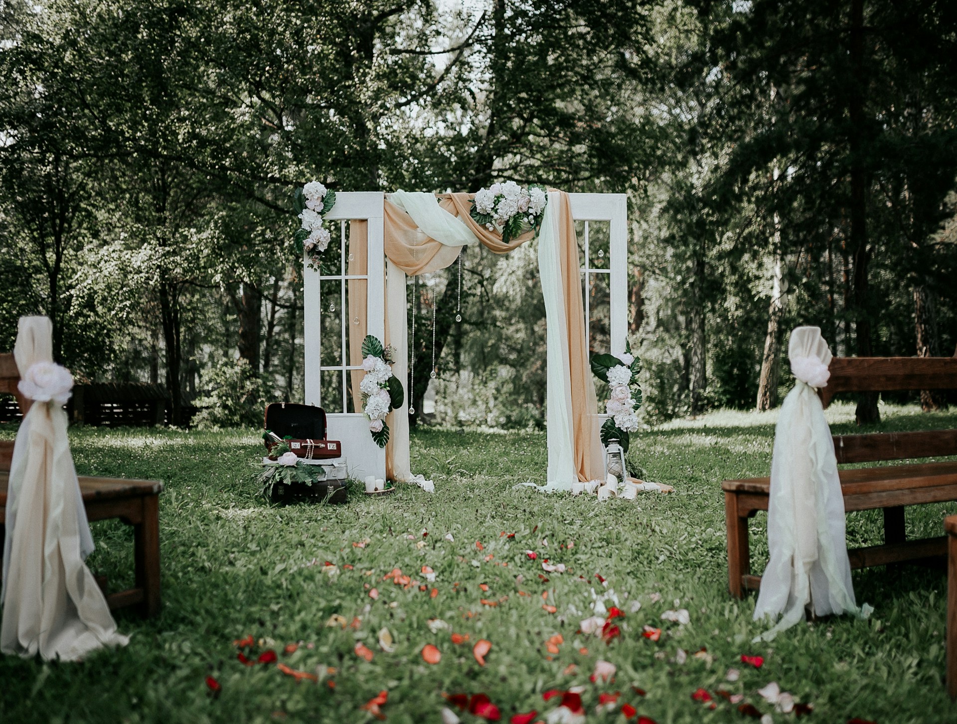 woman in white dress standing on green grass field
