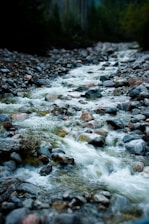 water flowing on rocky shore