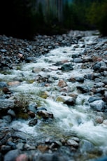 water flowing on rocky shore