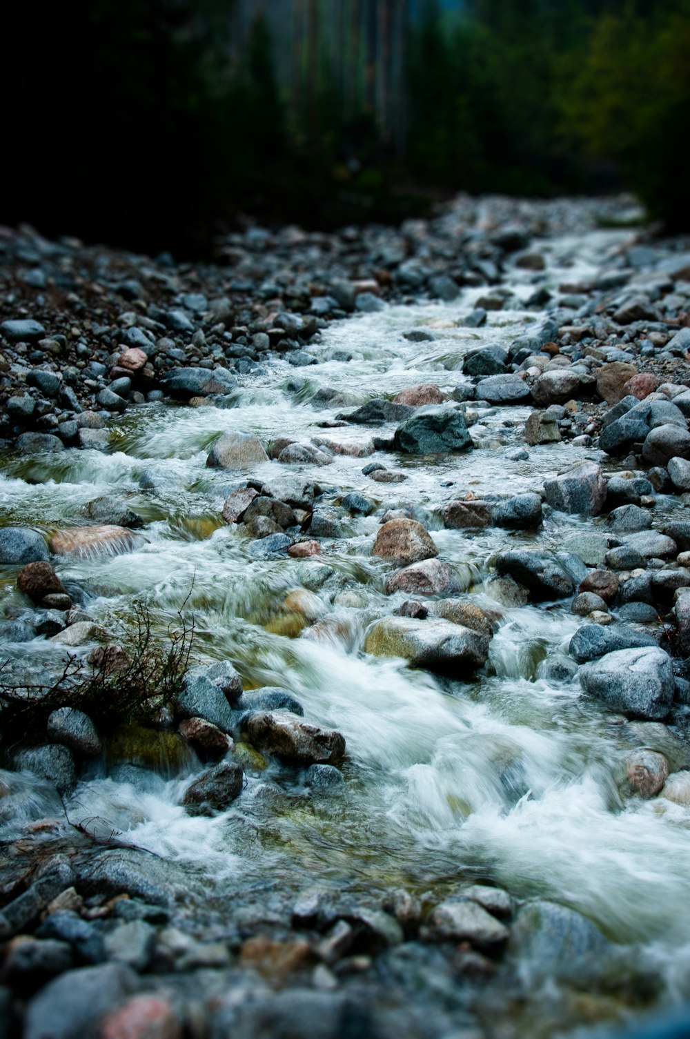 water flowing on rocky shore