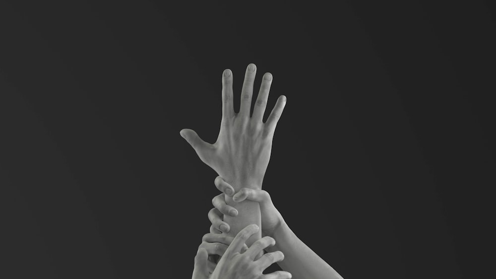 grayscale photo of persons hand