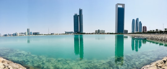 high rise buildings near body of water during daytime in Corniche Beach - Abu Dhabi - United Arab Emirates United Arab Emirates