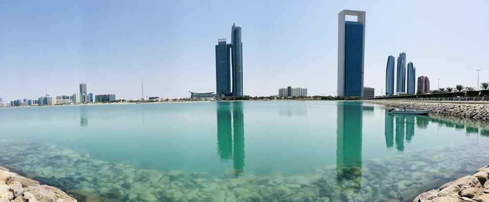 high rise buildings near body of water during daytime