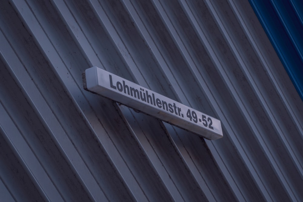 white and black wooden signage