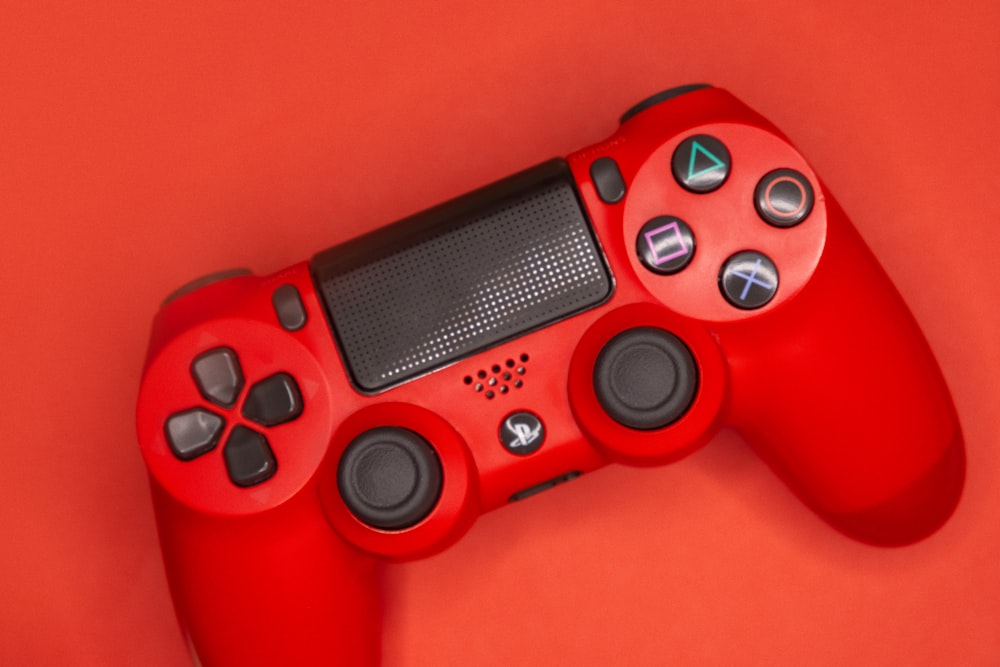 red and black sony ps 4 controller