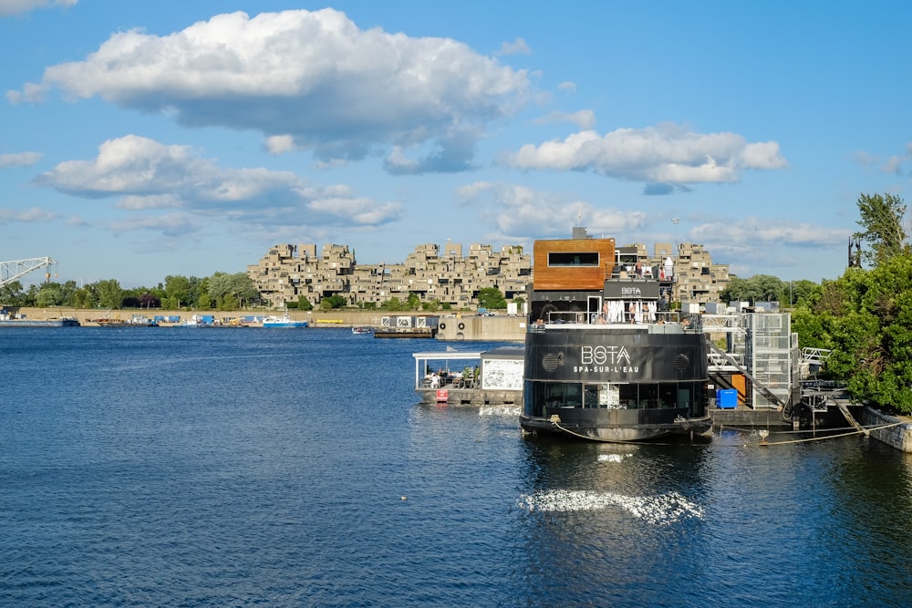 black and yellow boat on sea under blue sky during daytime