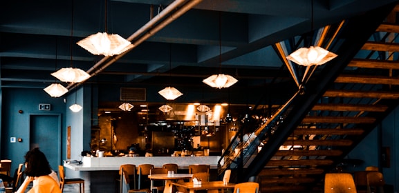 people sitting on chairs inside restaurant