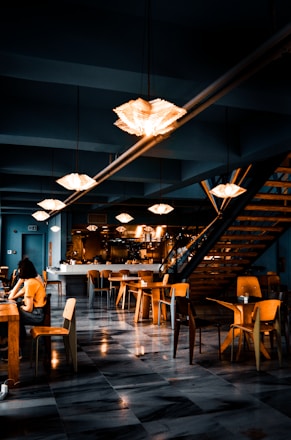 people sitting on chairs inside restaurant