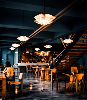 people sitting on chairs inside restaurant