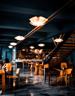 people sitting on chairs inside restaurant