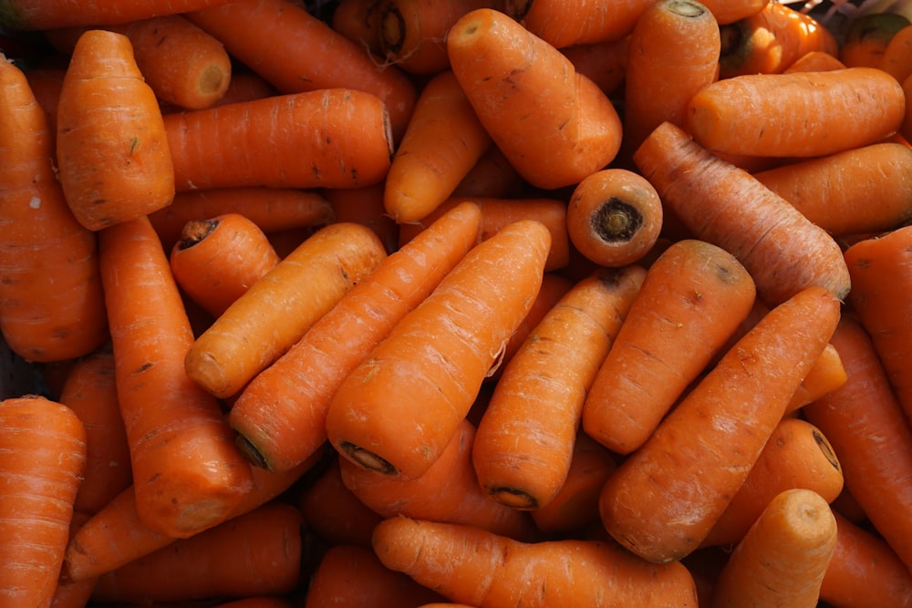 orange carrots on black surface