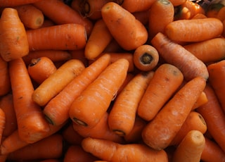 orange carrots on black surface