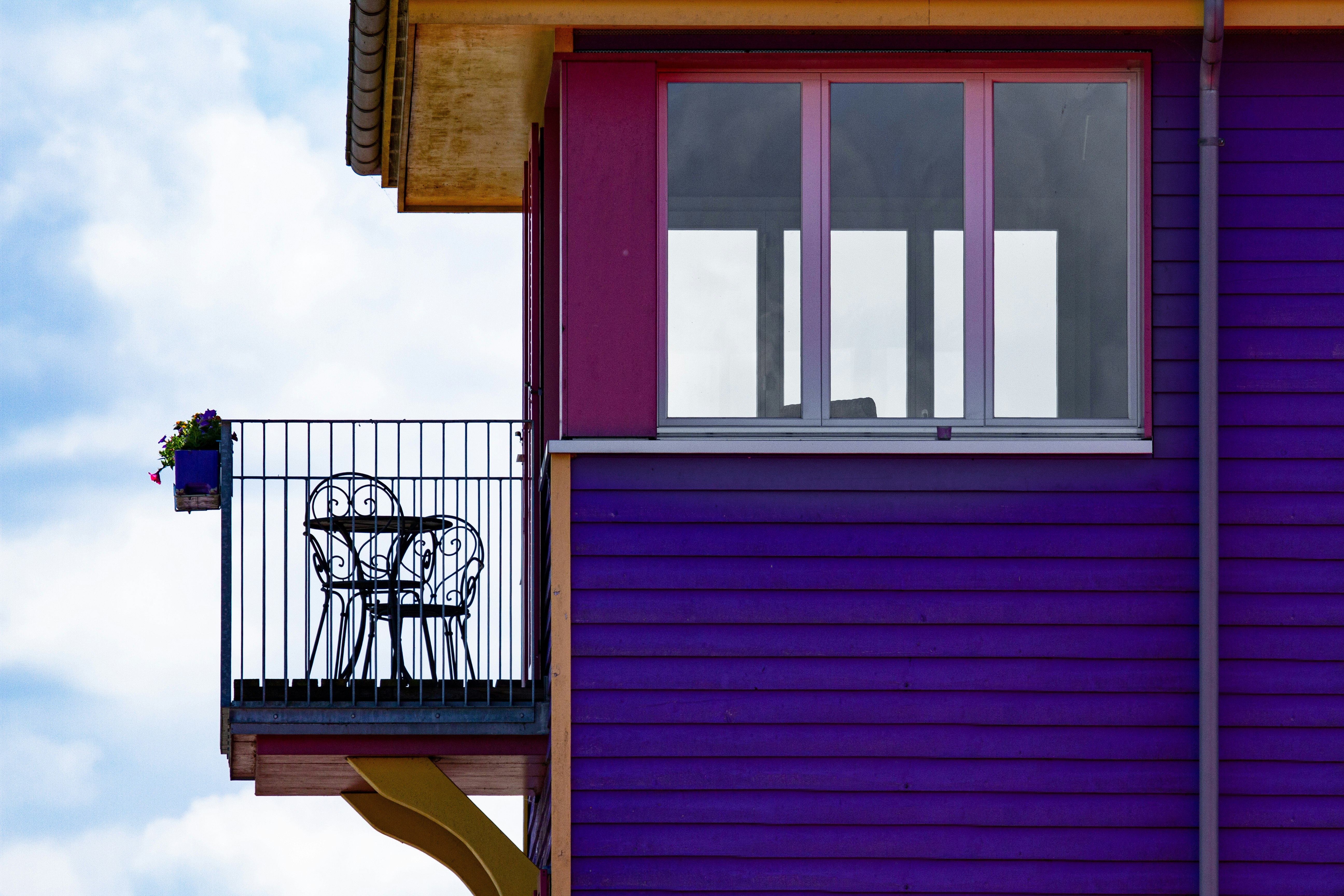 purple wooden house under white sky during daytime