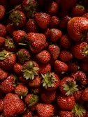 Close-up of ripe, juicy strawberries freshly picked from the garden.