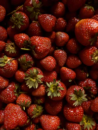 Close-up of a technician inspecting fresh strawberries in a high-tech quality control lab.