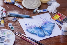 blue and purple click pen on white paper