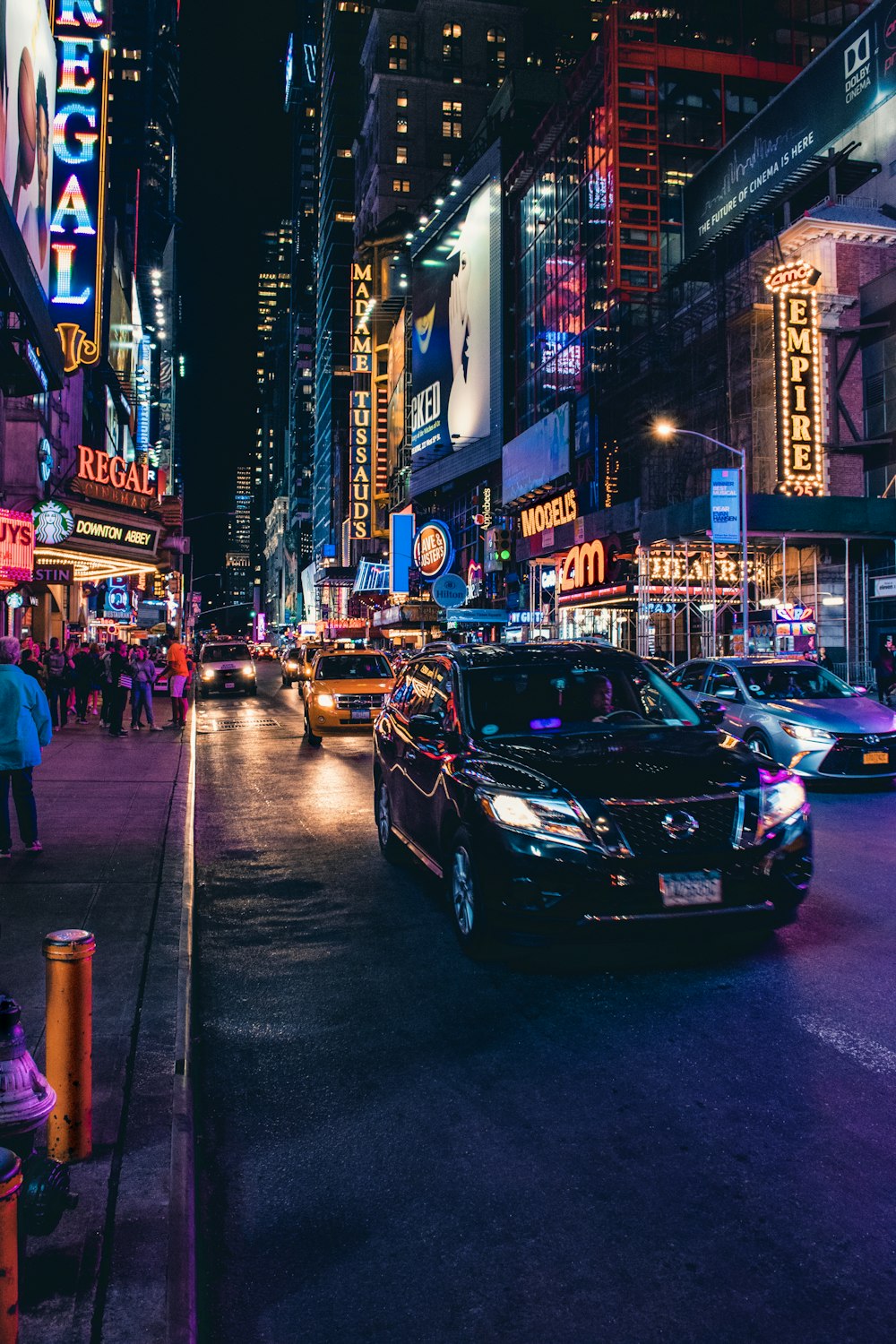 black car on road during night time