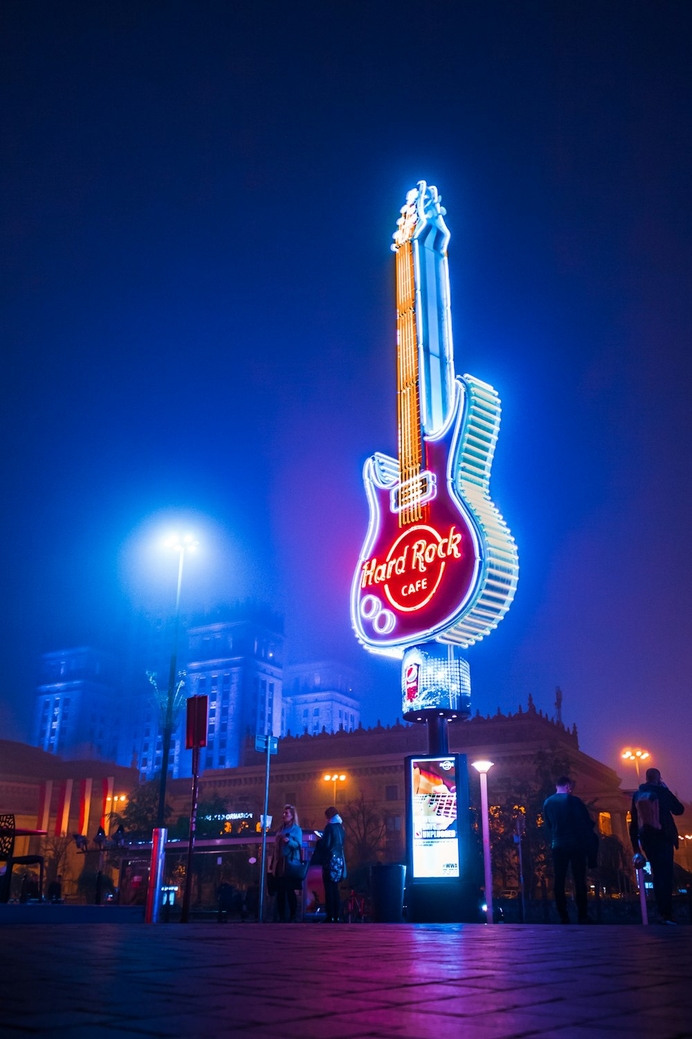 red and white coca cola led signage during night time