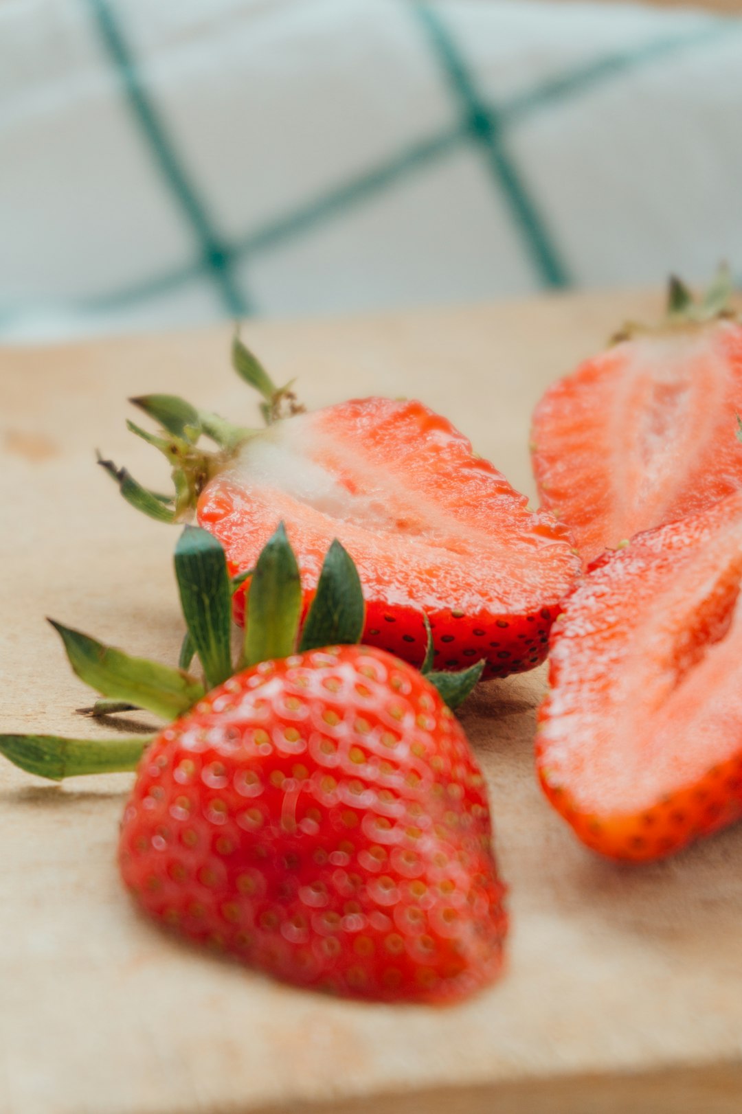 sliced strawberries on white ceramic plate