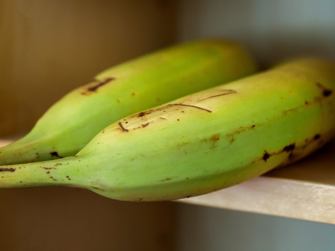 yellow banana fruit on white table