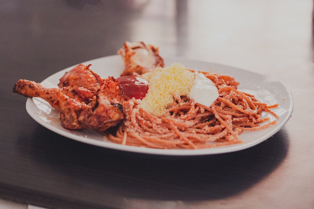 spaghetti on white ceramic plate