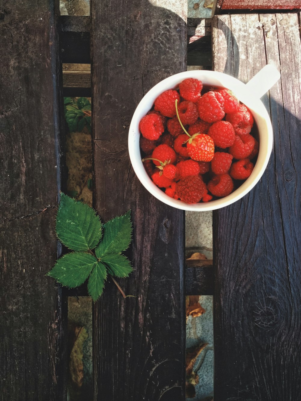 strawberries in white ceramic bowl