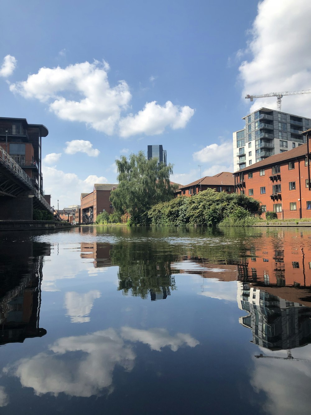 brown concrete building near body of water during daytime