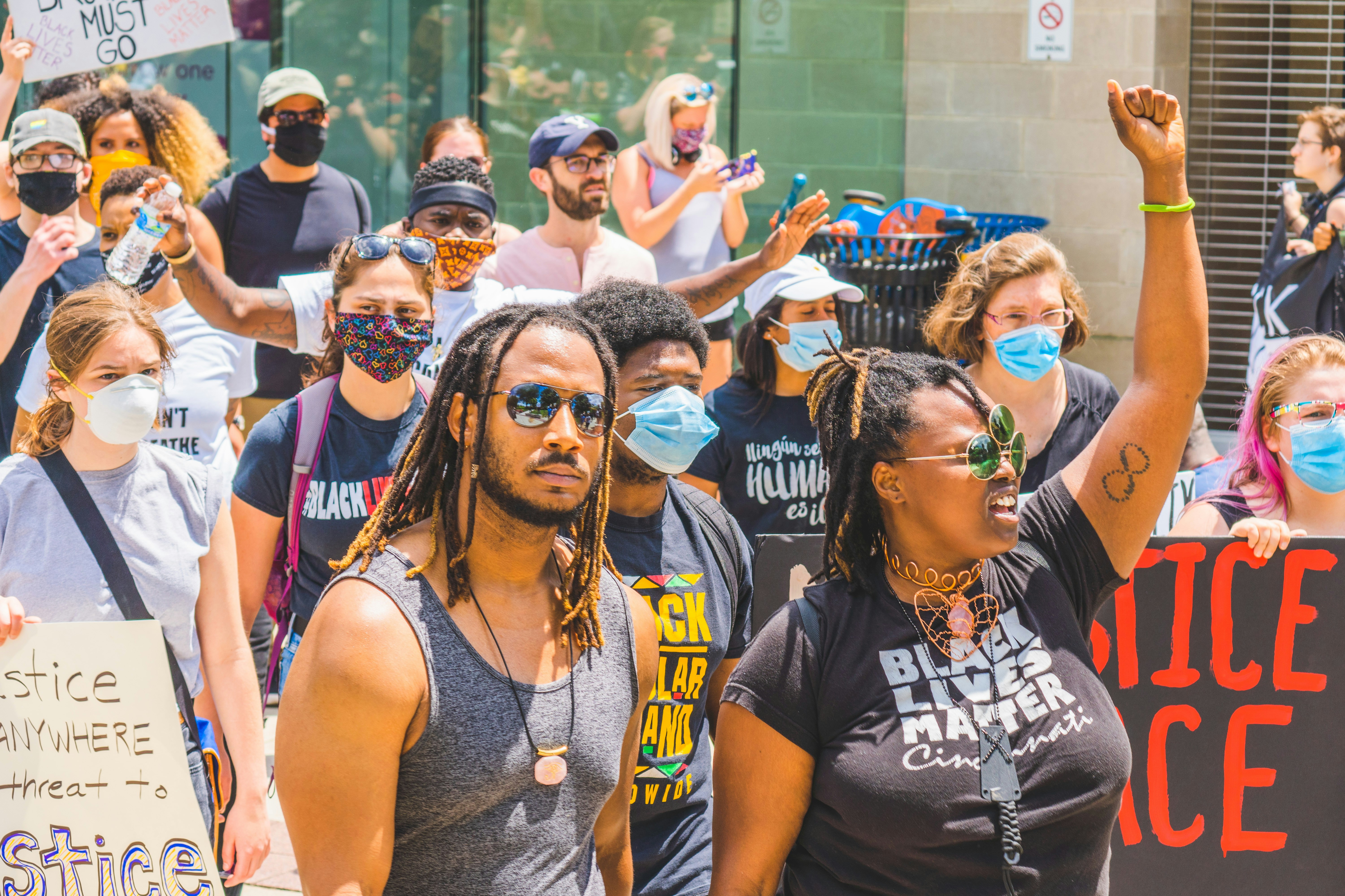 group of people in white tank top