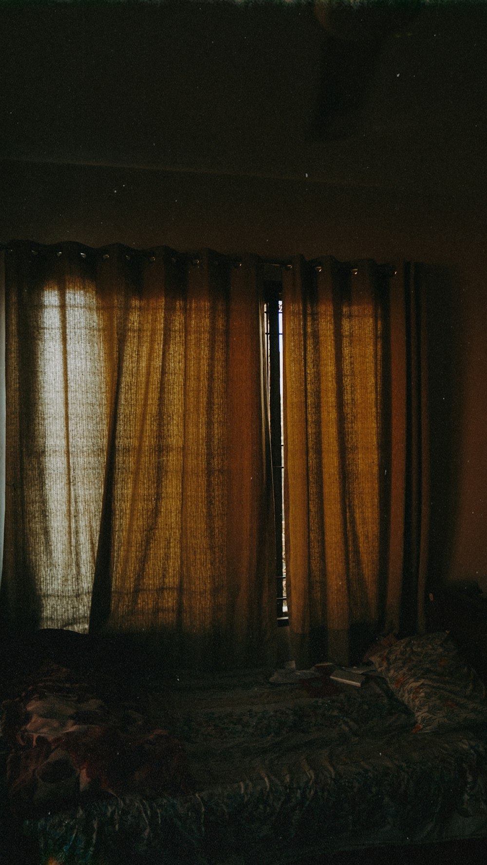 brown and beige window curtain