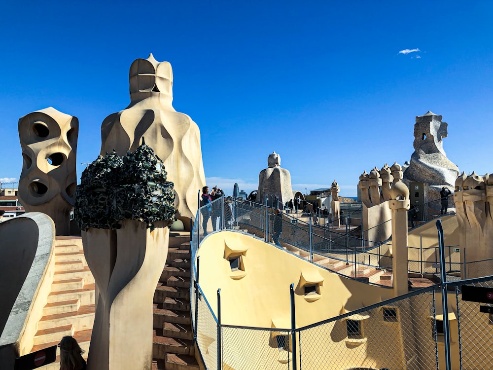 a couple of statues on top of a building