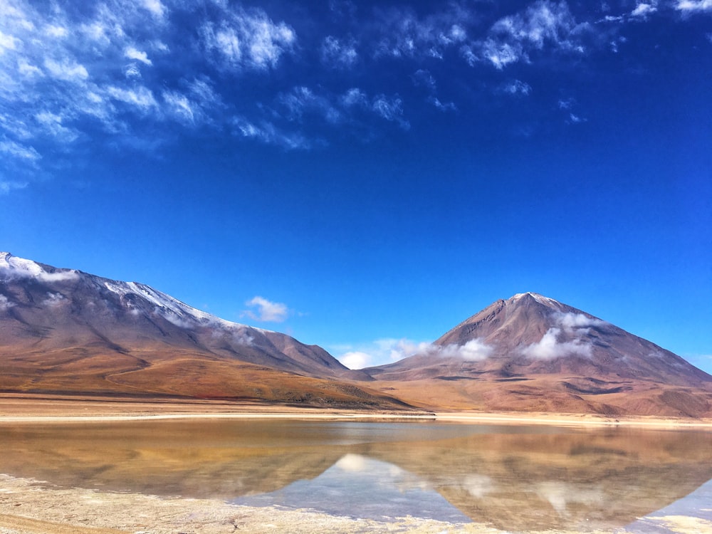 brown and white mountain under blue sky during daytime